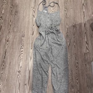 OUT FROM UNDER GREY JUMPSUIT